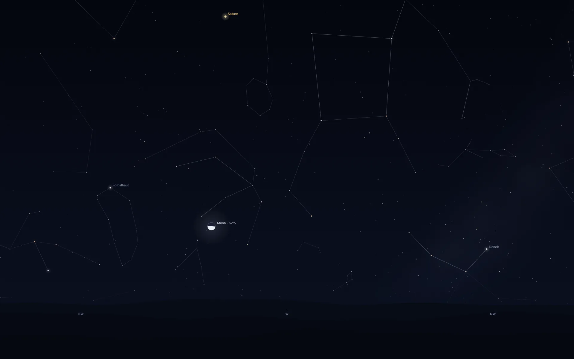 A dark night sky above low hills, with compass marks SW, W and NW along the bottom and faint constellation lines. Left of centre, a half-lit Moon labelled Moon · 52% sits low over the hills, with Saturn labelled near the top, Fomalhaut on the left and Deneb on the right.