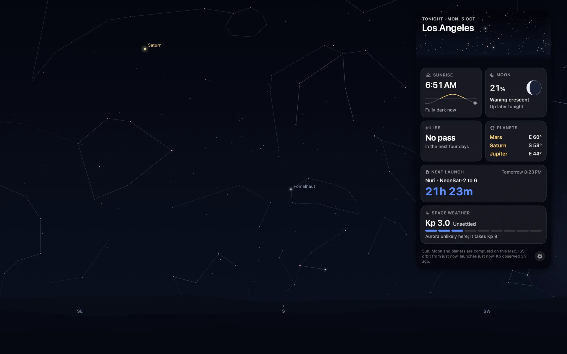 The briefing card at night over a starry desktop.