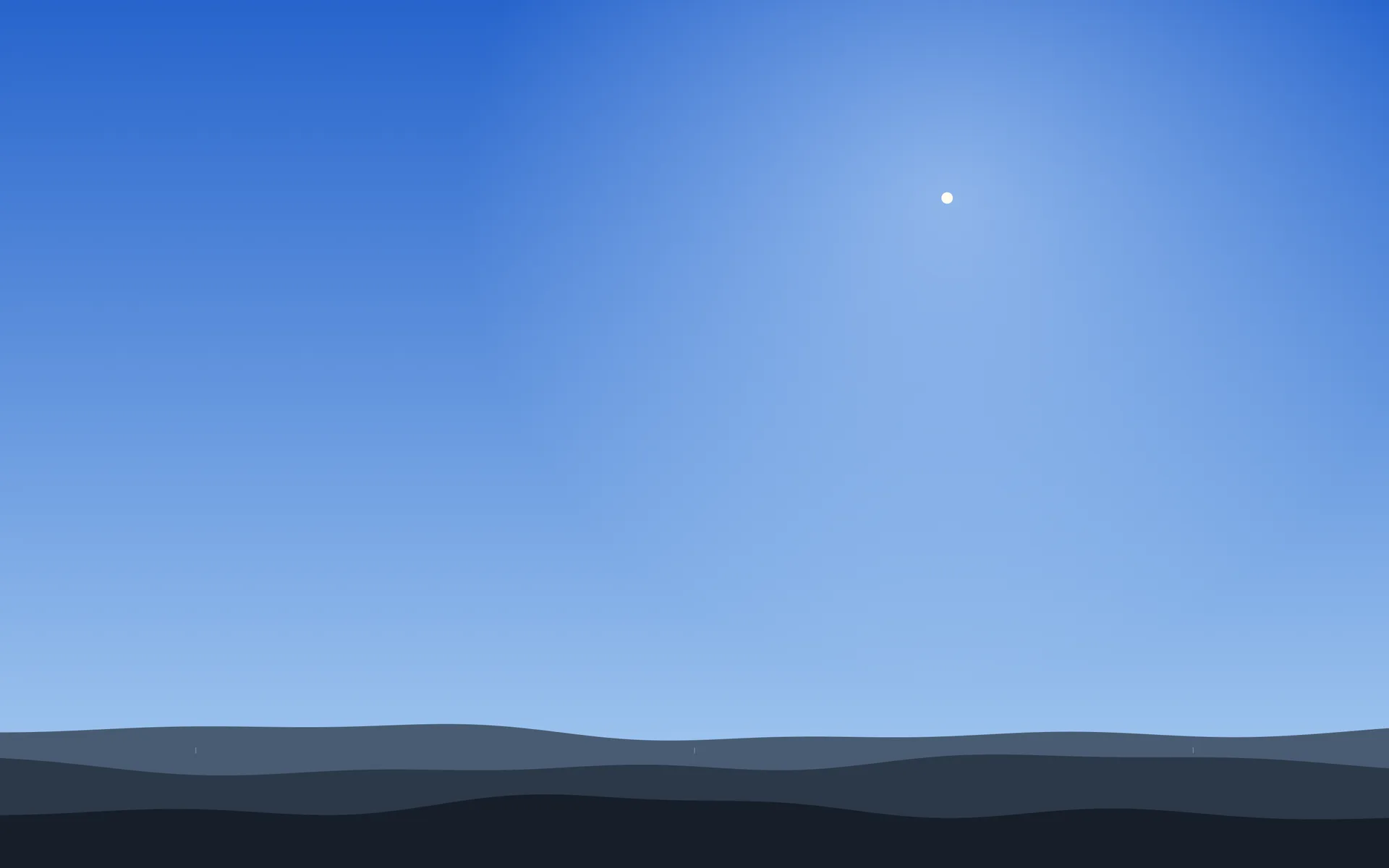 The day sky on the desktop: a quiet blue with the Sun's glare, over grey-blue hills.